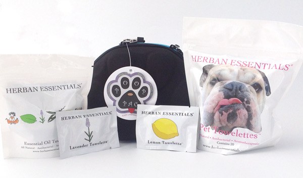 Herban Essentials pet towelettes beside a PoopPac