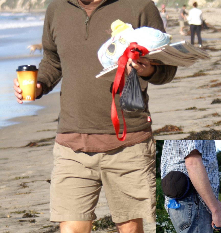 A man on the beach holding coffee in one hand and a leash, newspaper and dangling poop bag in the other